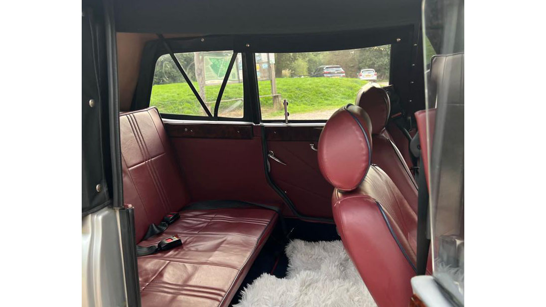 Burgundy Leather interior in Beauford with white carpet